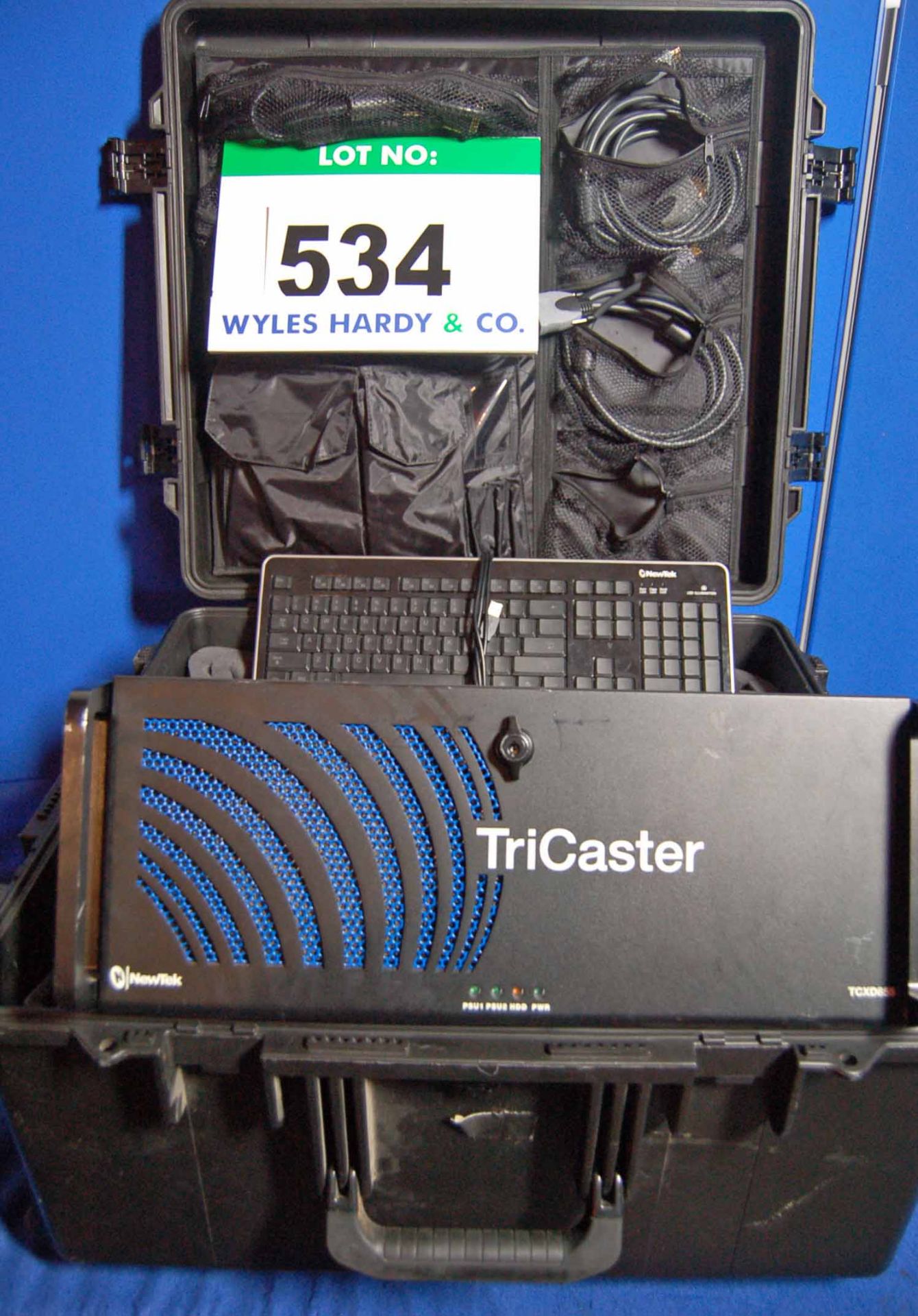 A NEWTEK TXCD850 CS 8-Channel Surface Controller together with A TRICASTER Media Personal Computer