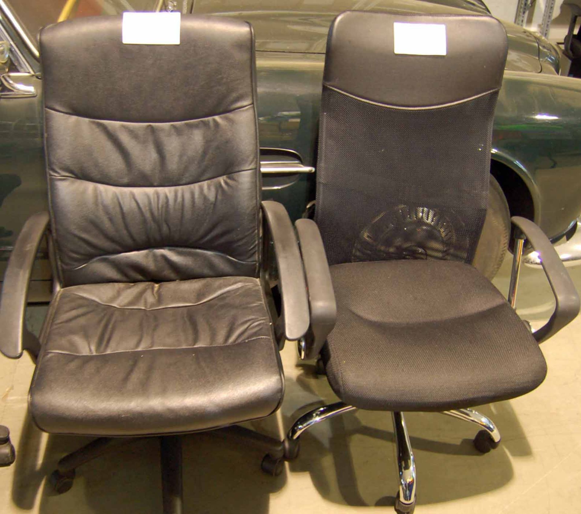 A Black Hide Effect High Backed Swivel Chair on 5-Point Base with Gas Lift & A High Backed Managers