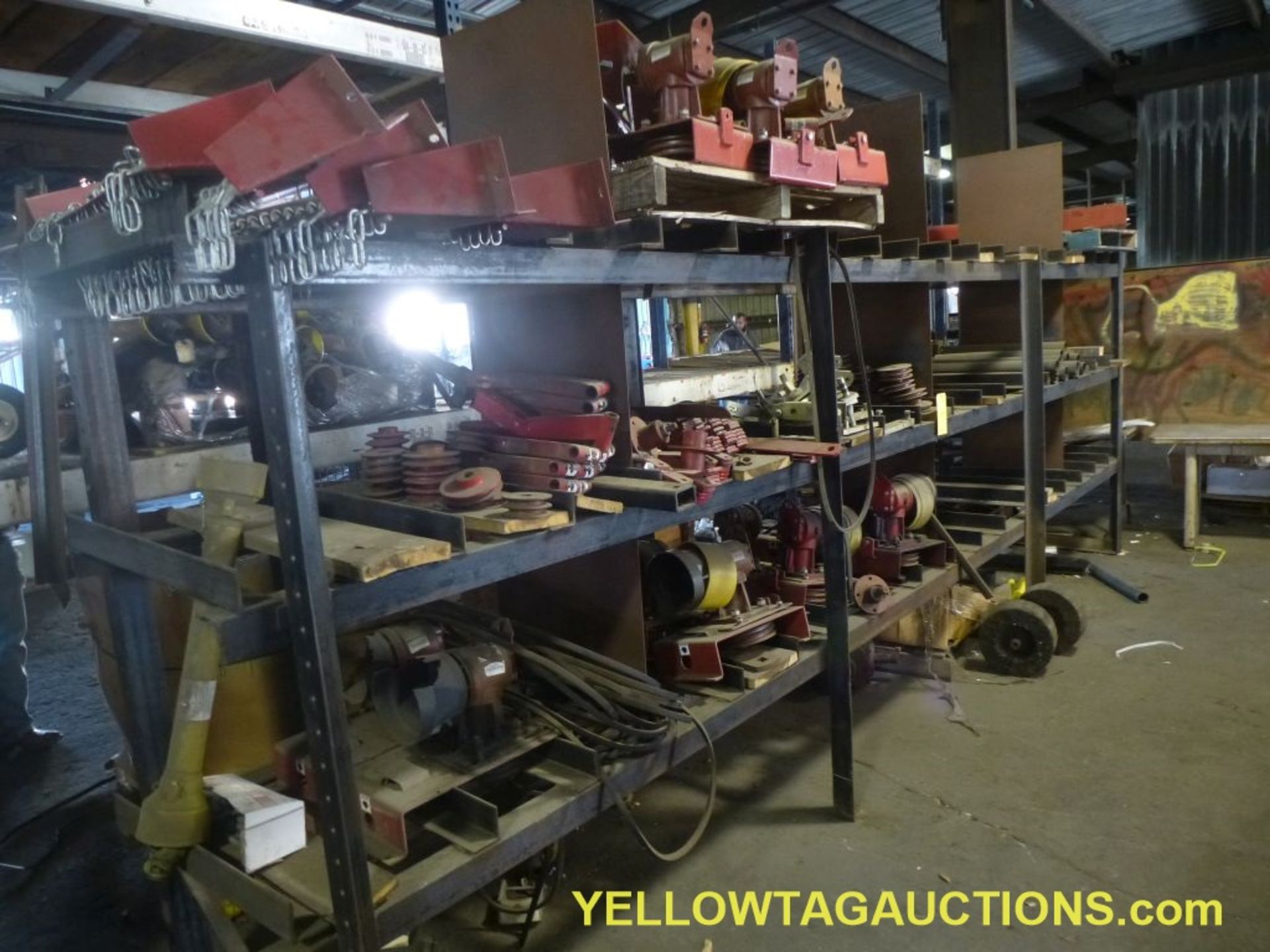 Lot of Racking with Contents|Includes:; (15) Gear Boxes; (4) Chain Guards; Brackets; Belts;