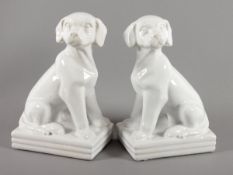 PAAR SITZENDE HUNDE, Fayence, weiß glasiert, H 28,5, BÖHMEN, um 1930