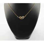 COLLIER, 750/ooo Gelbgold und Weißgold, besetzt mit kleinen Diamanten, L 41, 5,5g 22.00 % buyer's