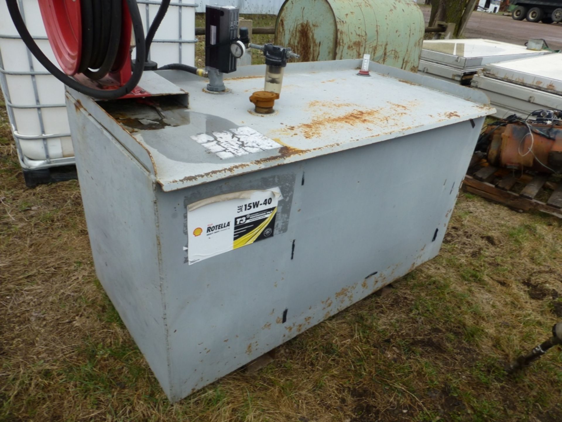 Metal oil tank with pump, hose, and reel