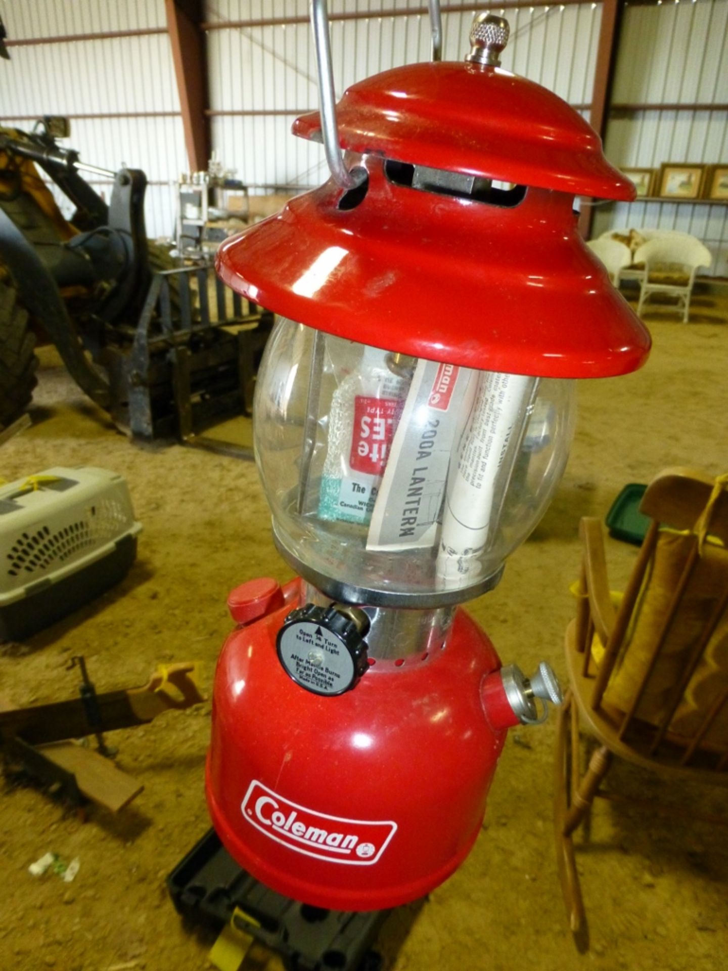 Rubber tote with Coleman camp supplies, propane stove, tanks, tripod, lantern, camp fuel!