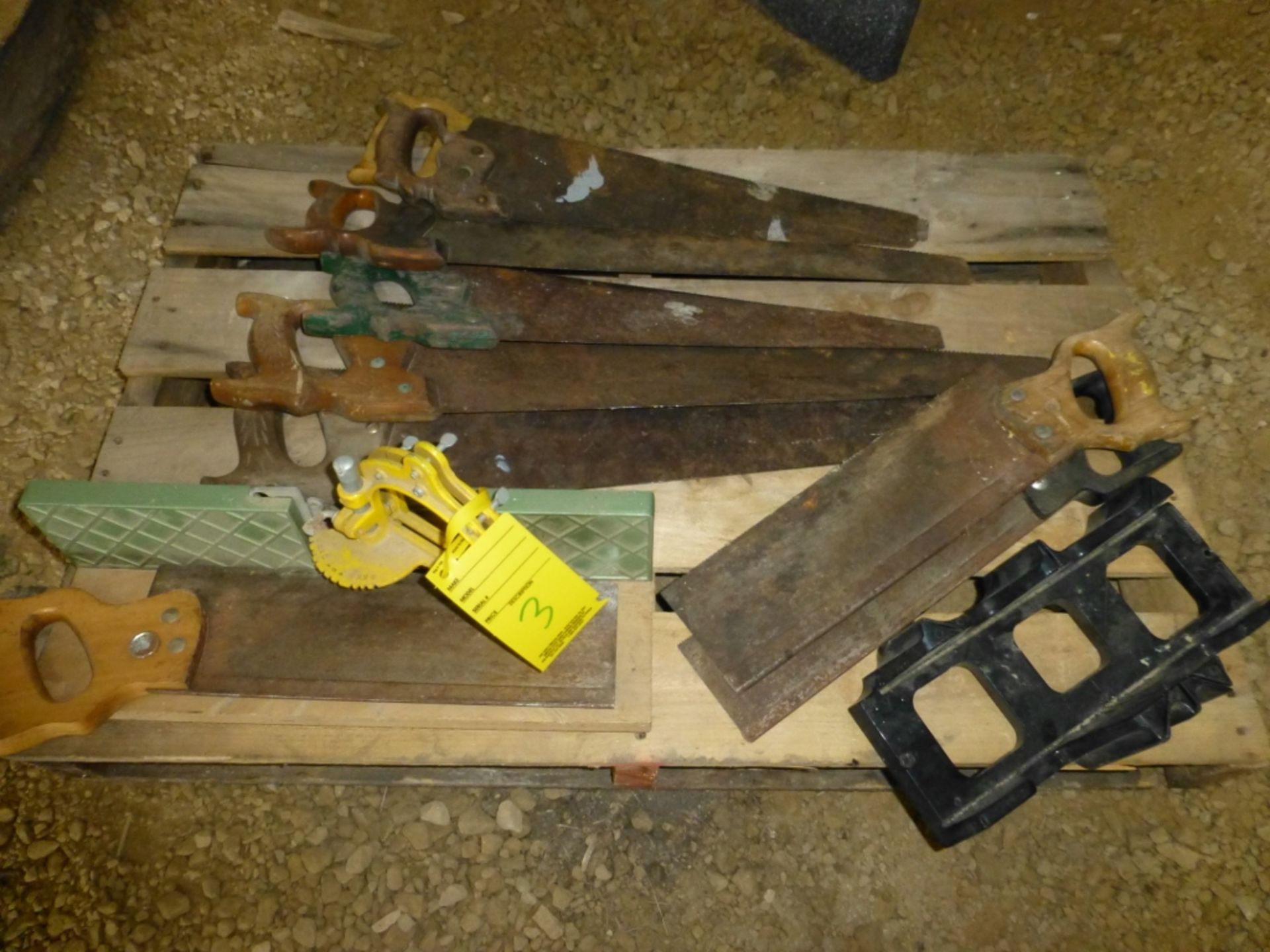 Assortments of hand saws and miter saw
