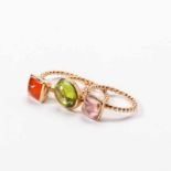 Three 14 carat pink gold and peridot, fire opal and pink tourmaline rings 21st century Each ring