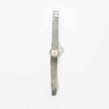 An 18 carat white gold and diamond ladies Rolex wrist watch Circa 1960 The silvered oval dial