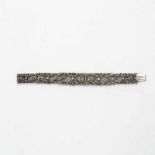 A diamond bracelet Early 20th century Designed as nine graduating openworked floral links, set with
