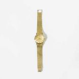 An 18 carat gold gentleman's wrist watch, Ebel Circa 1970 With gilt dial, baton numerals, date