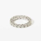 An 18 carat white gold and diamond eternity ring 21st century Set with eighteen ciruclar-cut