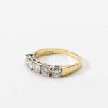 An 18 carat gold and diamond ring England, circa 1980 Designed as five circular-cut diamonds, to a