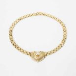 An 18 carat gold and diamond necklace Circa 1980 The necklace with a heart-shaped pendant, centered