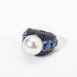An 18 carat white gold, sapphire, kyanite and South-Sea pearl ring 21st century The South-Sea pearl