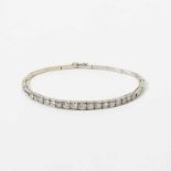 A platinum and diamond bracelet Circa 1920 Centered by a graduating row of seventeen old cut