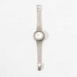 An 18 carat white gold and diamond Longines ladies wristwatch 20th century The silverette dial with