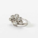 A platinum and diamond ring Circa 1930 Fan-shaped and set with old-cut diamonds varying in weight,