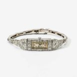 An Art Deco platinum and diamond ladies wrist watch Circa 1925 The rectangular movement within a