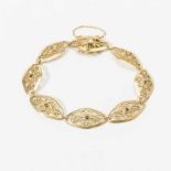 An Art Deco 18 carat gold and sapphire bracelet Circa 1925 Designed as openworked links centered by