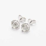 A pair of 18 carat white gold and diamond ear studs 21st century Each set with a circular-cut