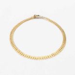 An 18 carat gold choker Circa 1970 Composed of flexible links. Gross weight approx. 29 grams L.