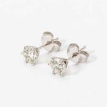 A pair of 18 carat white gold and diamond earstuds 20th century Each set with circular-cut diamond