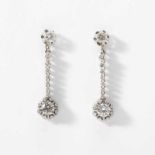 A pair of 14 carat white gold and diamond ear pendantsCirca 1960Each set with a circular-cut diamond