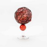 A red glass spherical vase by Bořek Šípek1949–2016Unique work, a red sphere wrapped in metal