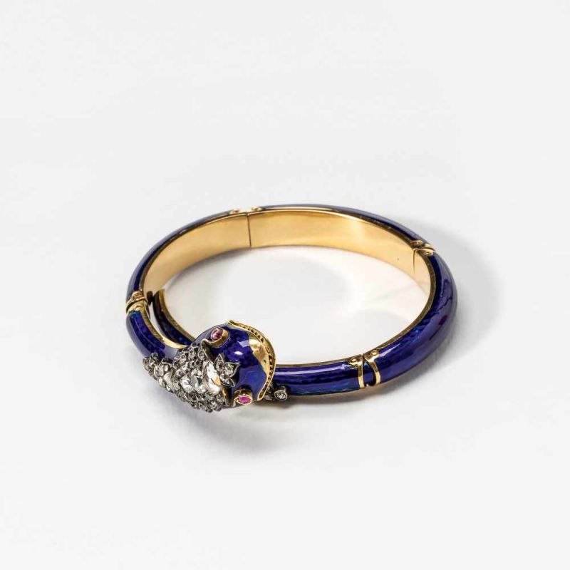 An 18 carat gold, diamond, ruby and blue enamel snake braceletCirca 1890The enamelled gold