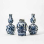 Two Dutch Delft blue and white double-gourd vases and a jarThe double-gourd vases marked 'PK' for