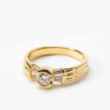An 18 carat gold and diamond ring21st centuryCentered by a circular-cut diamond, to a tapering