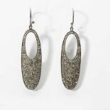 A pair of sterling silver and diamond ear pendants21st centuryThe oval-shaped pendants, throughout