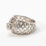 An 18 carat white gold diamond ring20th centuryOpenwork foliate design, centered by a brilliant-