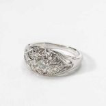 A palladium and diamond ring20th centuryCentered by an openwork foliate old-cut diamond set motif,