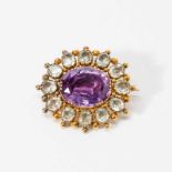 A 14 carat gold, amethyst and prasiolite broochLate 19th centuryCentered by an oval-cut amethyst