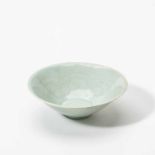 A Chinese Qingbai-type bowlRaised on a short cylindrical foot and wide slightly flared rim, the