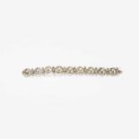 A 14 carat gold, silver, diamond and pearl bracelet20th century Designed as foliate-shaped links,