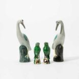 A pair of Chinese export green-glazed models of parrots and a pair of cranesThe parrots standing