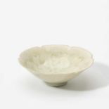 A Chinese flower-shaped Qingbai bowlSong dynasty (960-1279)Modelled with six lobes, the interior