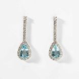 A pair of 18 carat white gold diamond and aquamarine ear pendants21st centuryEach with pear-shaped