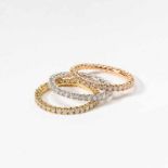 Three 18 carat gold and diamond eternity bands21st centuryDesigned as a pink, respectively a