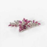 A 14 carat white gold, diamond and ruby spray broochCirca 1980Designed with circular-cut diamonds