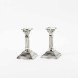 A pair of silver Louis XVI-style candlesticksMarked ''?92?' and 'ZI'Each on square stepped foot