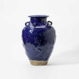 A large Chinese blue-glazed martavan storage jarLate Qing dynasty (1644-1912)The shoulder applied