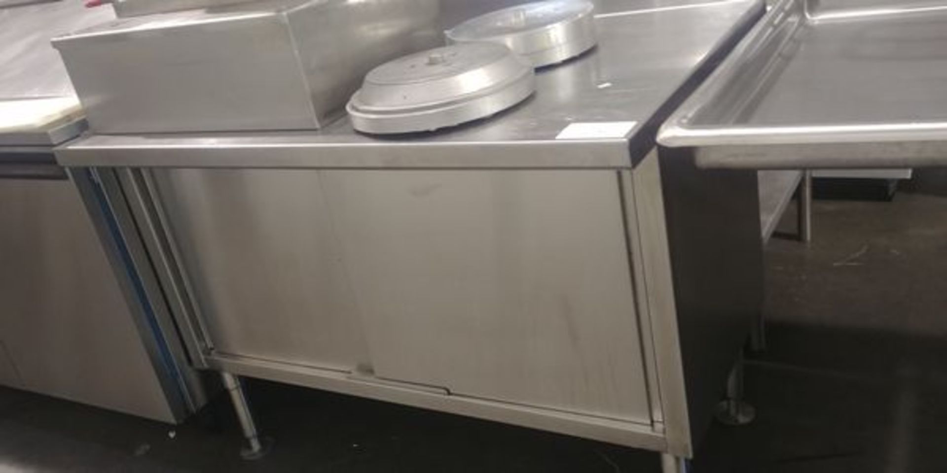 4 Ft Stainless Steel Commercial Counter with Sliding Doors and Backsplash