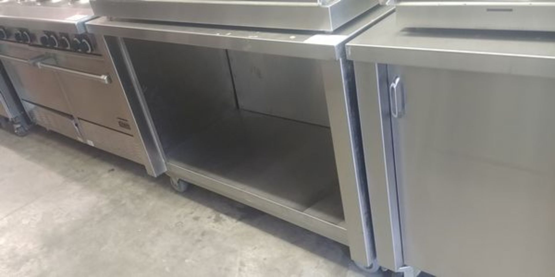 4 ft Custom Stainless Steel Table with Back Splash on Casters