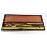 GILBERT & WRIGHT OF LONDON; a 2" cased brass telescope with folding tripod,