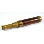ABRAHAM & CO OF LIVERPOOL; a 1.25" brass four-draw telescope with rosewood barrel, length 17cm.