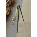 A WWII period issue khaki painted mahogany folding tripod with brass mount inscribed 'STAND.