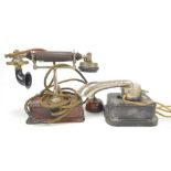 An early 20th century 'The Magnet' telephone on a wooden stand, height 21cm,