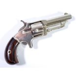 A small five shot rimfire revolver, the barrel stamped 'Wesson & Harrington, Worcester, Mass,