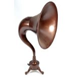 A Burndept 2000 Ohms brown painted radio horn mounted on a circular base with three paw feet,